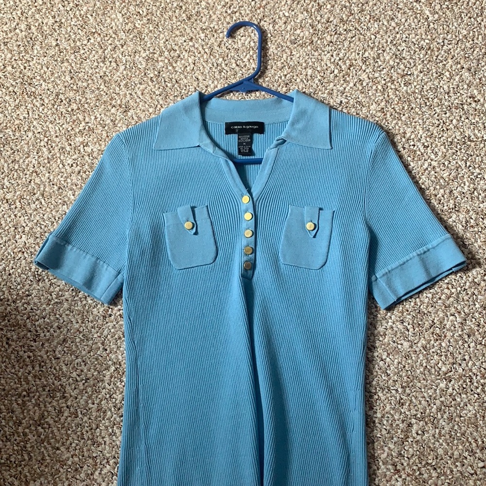 Short sleeve light blue sweater. Smoke-free home.